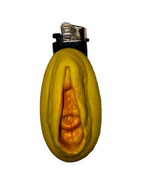 diablo picante - mechero vagina dorado